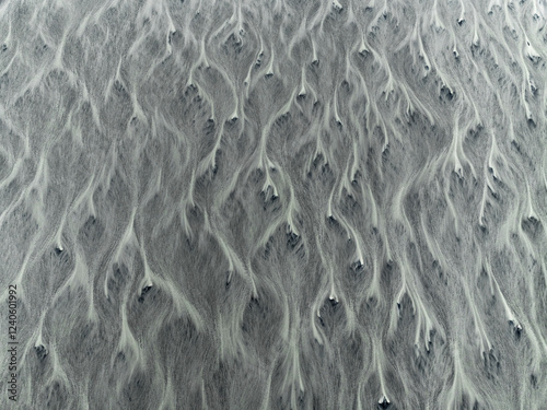 Aerial view of abstract patterns in a glacier river, Kalfafell, Iceland. photo