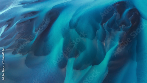 Aerial view of abstract forms and water patterns in tranquil blue and turquoise hues, Selfoss, Iceland. photo