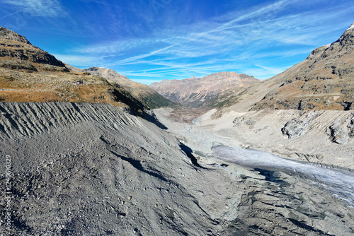 Aerial view of the majestic morteratsch glacier and rocky moraine in a serene winter landscape, Val Morteratsch, Samedan, Switzerland. photo