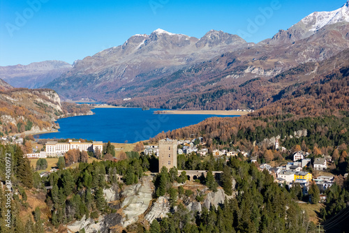 Aerial view of tranquil Silsersee lake surrounded by majestic mountains and picturesque village in autumn, Maloja, Switzerland. photo