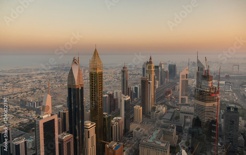 Dubai, United Arab Emirates - 07 December 2018: Aerial view of beautiful modern skyscrapers and cityscape at sunset, Dubai, United Arab Emirates. photo