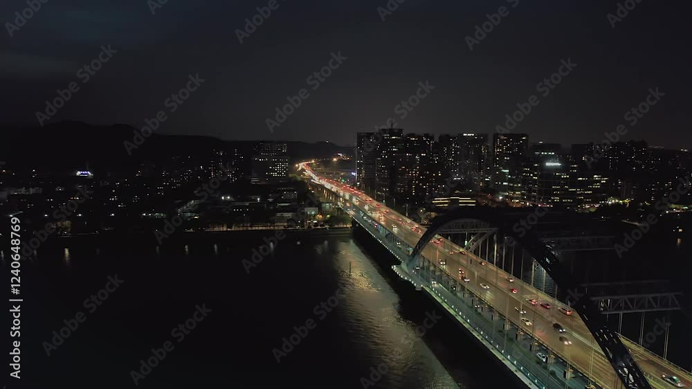 Evening cityscape view with busy bridge and illuminated skyline in a vibrant metropolis