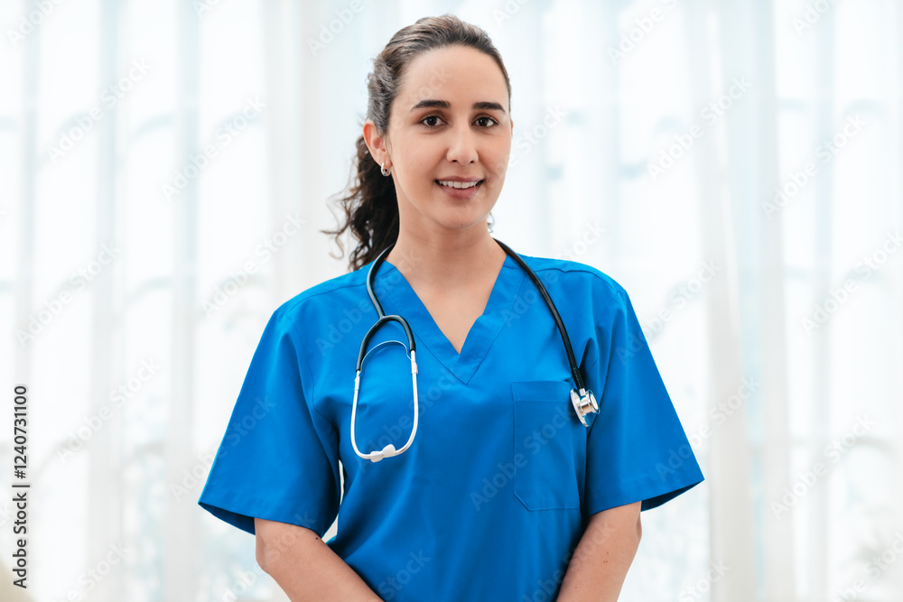 Smiling Female Doctor in Blue Scrubs