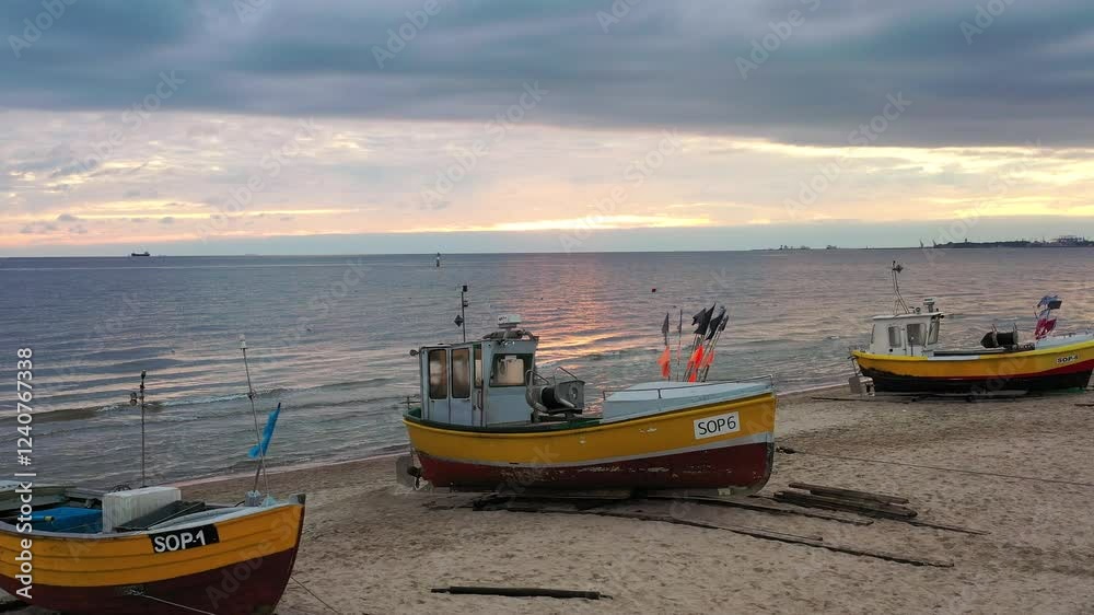 Fishing boats on the beach of Baltic Sea in Sopot at sunrise, Poland Fishing boats on the beach of Baltic Sea in Sopot at sunrise, Poland