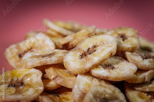 Macro shot of freeze-dried banana chips, highlighting their crunchy texture and golden yellow color. Perfect for food, snacks, and healthy eating themes. photo