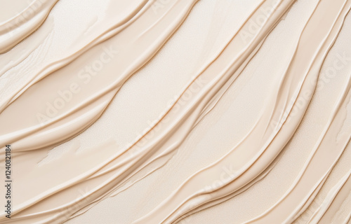 A close-up of liquid foundation texture in light beige hues, showcasing visible skin lines and smooth strokes forming delicate curves. Set against a white background, the creamy makeup texture is high