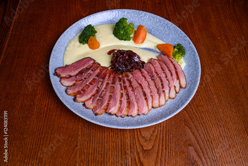 Delicious grilled duck breast fillet with potatoes