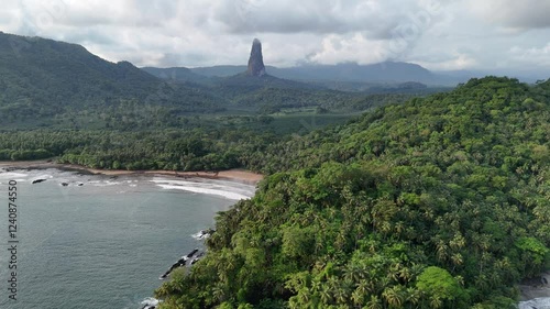 Sao Tome and Principe - Aerial View of Pico Cao Grande. Iconic Volcanic Needle Rising Above Lush Tropical Rainforest. View From Praia Grande. 