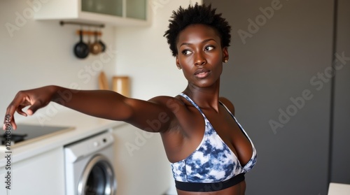 Woman Practicing Yoga in Modern Kitchen With Focus on Flexibility and Balance