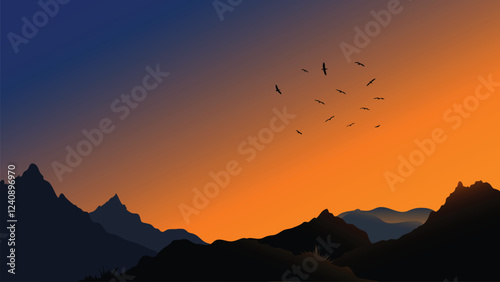 Mountain silhouette at sunset with flying birds in the sky
