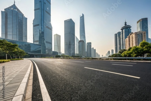 Wide asphalt road stretching through a modern cityscape with sleek skyscrapers and glass towers in the background, cityscape, concrete highway