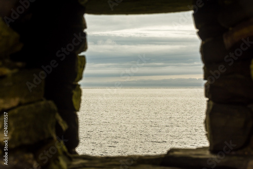 the waters of the Atlantic ocean seen from the ruins of Jarlshof in Shetland Islands  photo