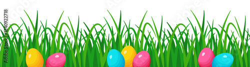 Easter seamless border with grass and colorful eggs. 