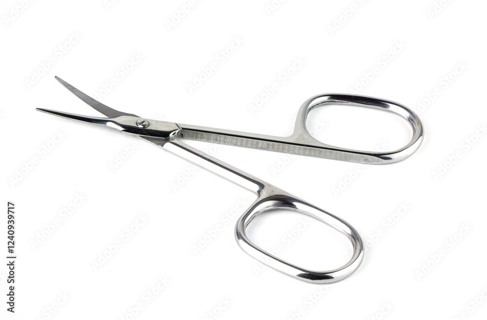 small steel scissors on neutral backdrop