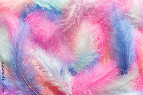 Background with feathers in pastel colors. Selective focus.