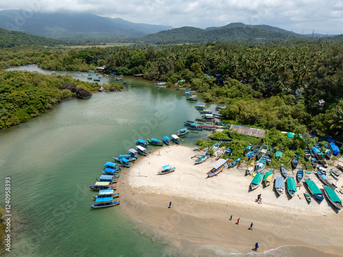 Viele Blaue Boote und Kanus und kaya, an der Lagune in Agonda Goa Indien photo