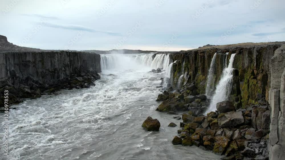 Waterfall on a turbulent river in Iceland, view from above Waterfall on a turbulent river in Iceland, view from above