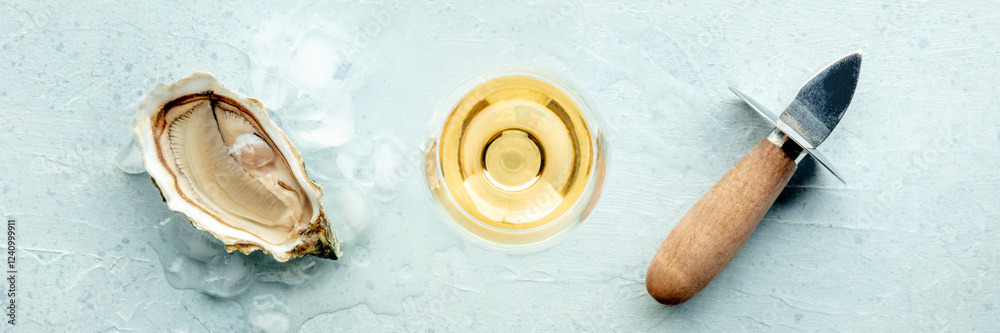 Φωτογραφία Fresh raw oyster with a glass of white wine and an oyster knife, on ice, on a sl