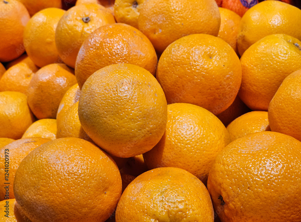 Many organic oranges at supermarket. Many organic oranges at supermarket.