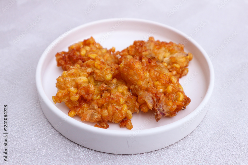 Delicious Crispy Corn Fritters on a Plate Delicious Crispy Corn Fritters on a Plate