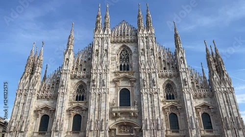 Duomo di Milano Cathedral facade on sunny day. Italian landmark in Town Square. Catholic religion, tourism attraction concepts