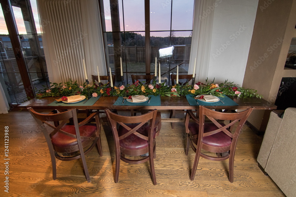 Obraz premium Decorative elements for festive events, home decorations. Festive table decorations, flowers and tableware