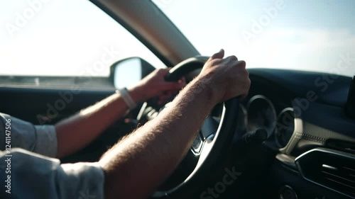Wallpaper Mural Driver holds steering wheel, enjoying road trip	 Torontodigital.ca
