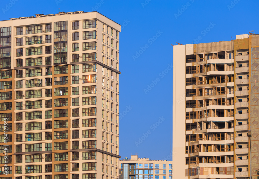 City view on a sunny day. Modern buildings, walls and windows. City view on a sunny day. Modern buildings, walls and windows.