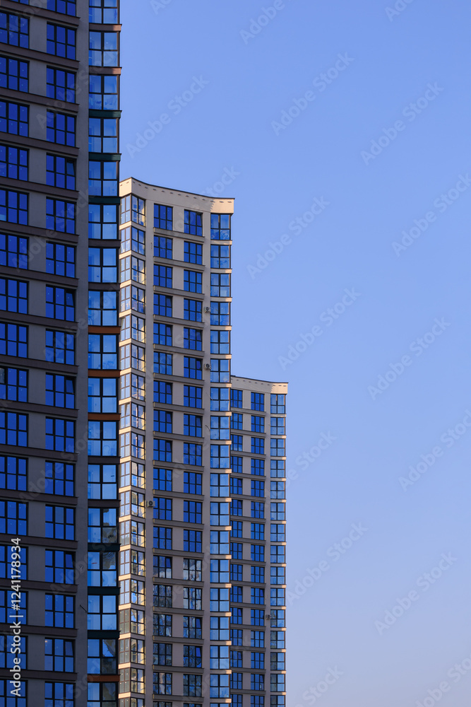 City view, modern buildings and skyscrapers against the blue sky. City view, modern buildings and skyscrapers against the blue sky.