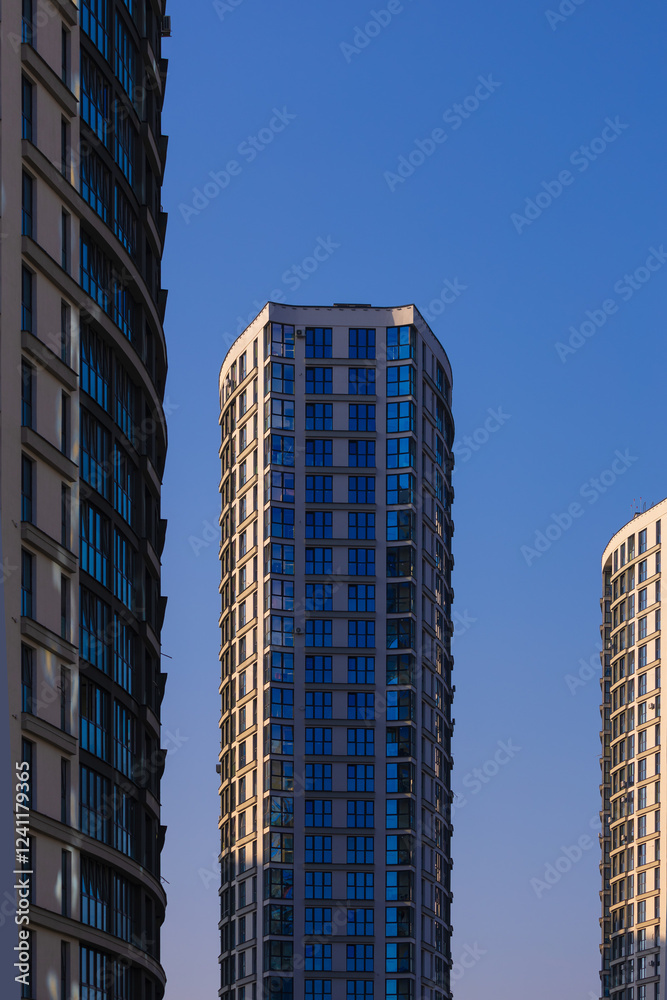 Fototapeta premium Cityscape on a summer day, modern buildings and houses 