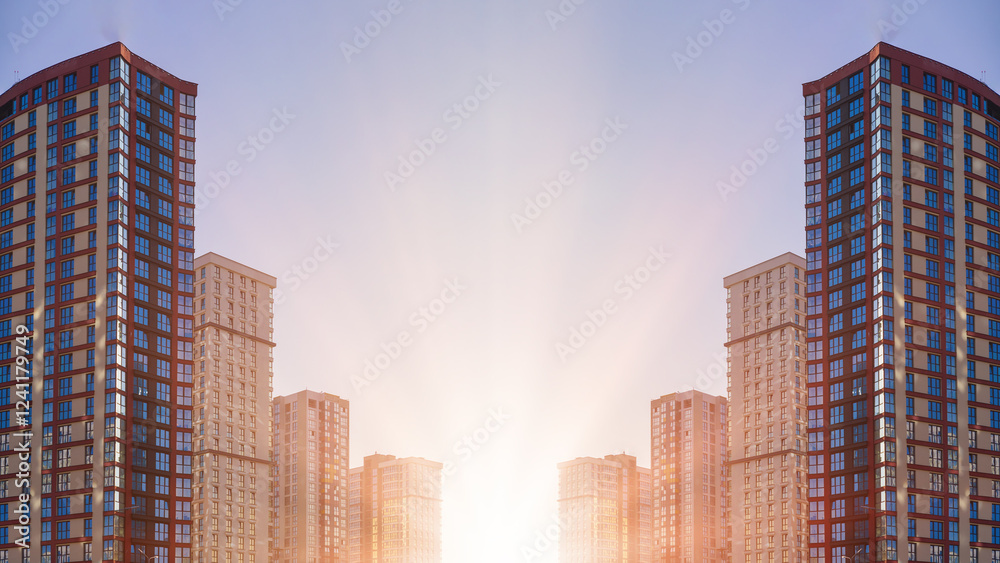 Fototapeta premium Modern buildings, walls and windows, reflections and sun rays. City view on a sunny day.