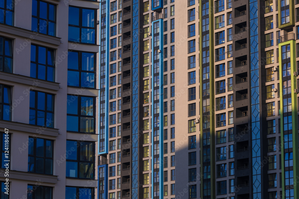 City view on a sunny day. Modern buildings, walls and windows. City view on a sunny day. Modern buildings, walls and windows.