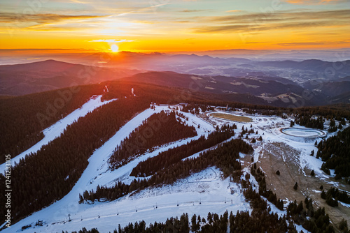 Aerial drone morning view of ski resort Rogla at sunrise dawn. Panoramic winter shot of Ski center Rogla, Slovenia