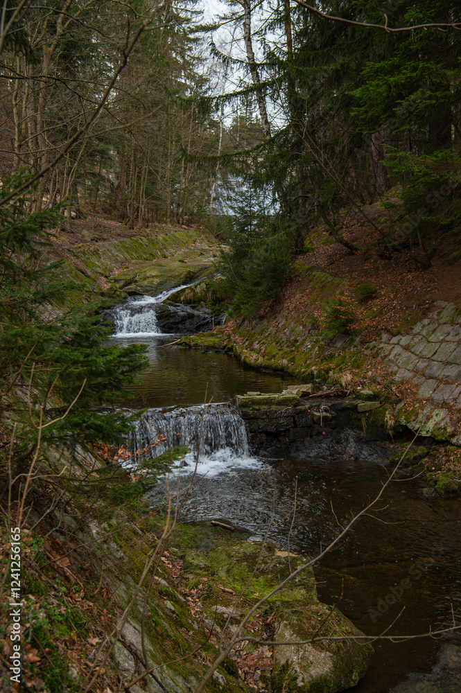 The Lomnica dam in Karpacz, Lower Silesian Voivodeship, Poland. River bed of the mountain river Łomnica in the Karkonosze Mountains The Lomnica dam in Karpacz, Lower Silesian Voivodeship, Poland. River bed of the mountain river Łomnica in the Karkonosze Mountains