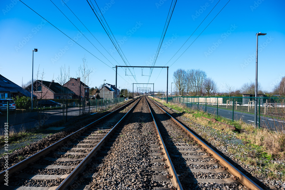 Double railway tracks of a local line at the Belgian countryside, Flemish Brabant, Belgium Double railway tracks of a local line at the Belgian countryside, Flemish Brabant, Belgium