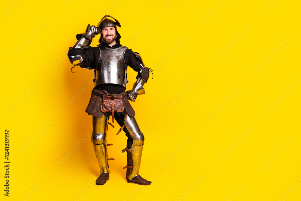 Medieval knight in full armor posing confidently against a bright yellow background Medieval knight in full armor posing confidently against a bright yellow background