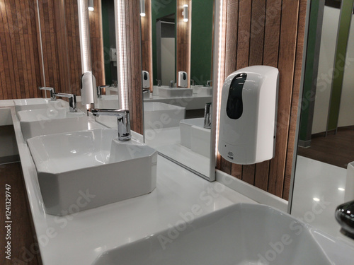 Automatic liquid soap dispenser in public toilet