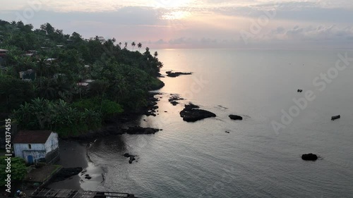 Sao Tome and Principe - Aerial View of Angolares and Beach. Coastal Town Surrounded by Lush Green Hills and Pristine Shoreline.