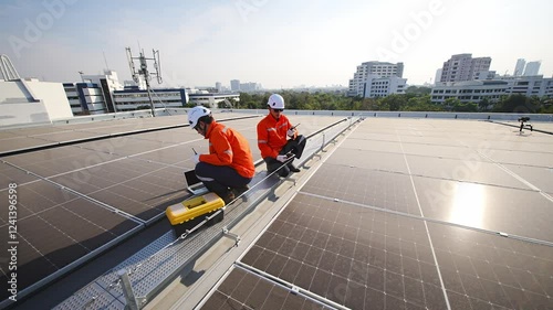 Wallpaper Mural Workers perform maintenance on solar panels at a rooftop installation site during the afternoon,   workers dressed in bright safety gear inspect and maintain solar panels on a rooftop. The clear sky Torontodigital.ca