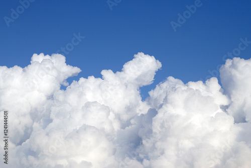 Fluffy Cumulus Clouds in summer sky