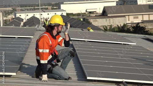 Wallpaper Mural Workers perform maintenance on solar panels at a rooftop installation site during the afternoon,   workers dressed in bright safety gear inspect and maintain solar panels on a rooftop. The clear sky Torontodigital.ca
