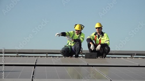 Wallpaper Mural Workers perform maintenance on solar panels at a rooftop installation site during the afternoon,   workers dressed in bright safety gear inspect and maintain solar panels on a rooftop. The clear sky Torontodigital.ca