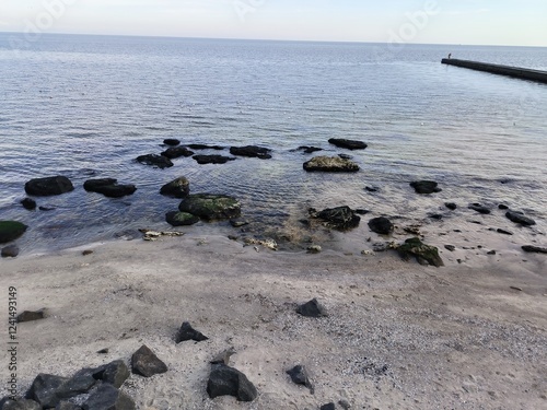 sea, stones on the seashore, calm sea, nature background