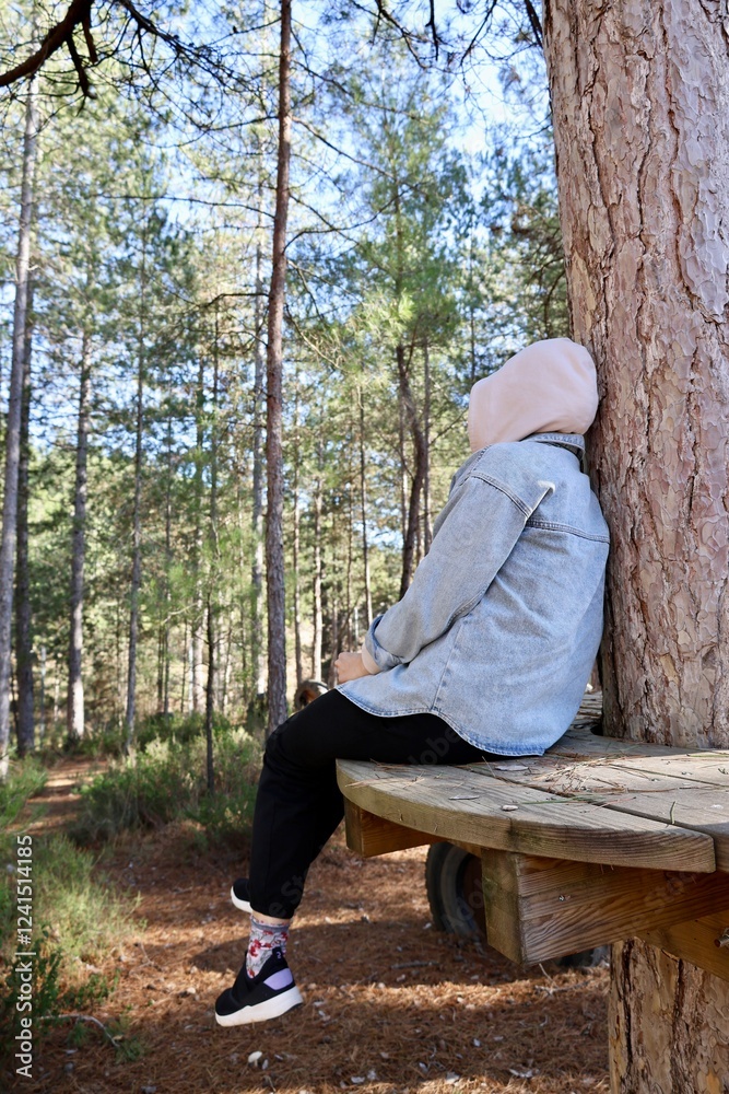 Fototapeta premium treehouse retreat. Woman sitting outdoors. High quality photo