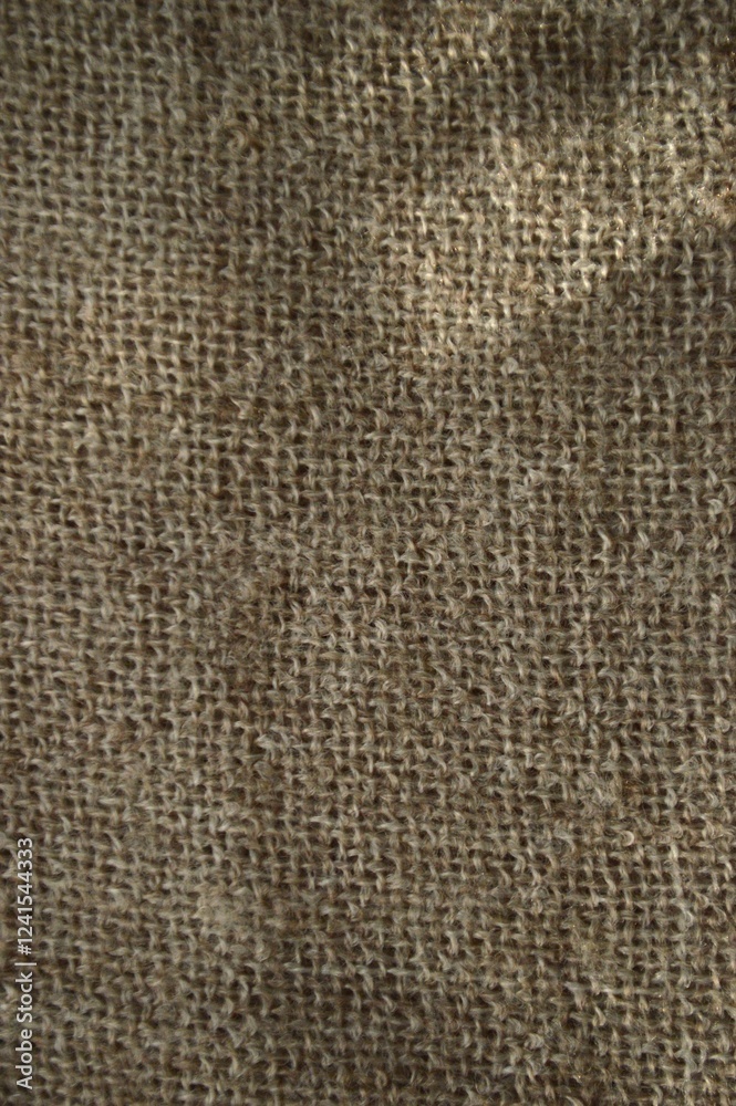 Detailed view of burlap's coarse texture, showing its natural fibers and rustic look. Detailed view of burlap's coarse texture, showing its natural fibers and rustic look.