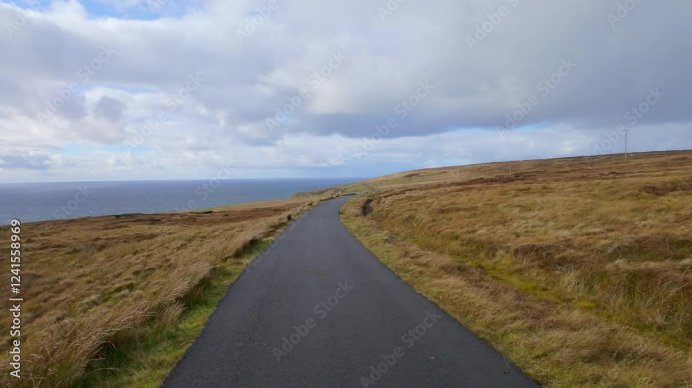 Arranmore Island Donegal Ireland - A peaceful road winding through beautiful landscapes, ideal for nature lovers and travel adventures. Arranmore Island Donegal Ireland - A peaceful road winding through beautiful landscapes, ideal for nature lovers and travel adventures.