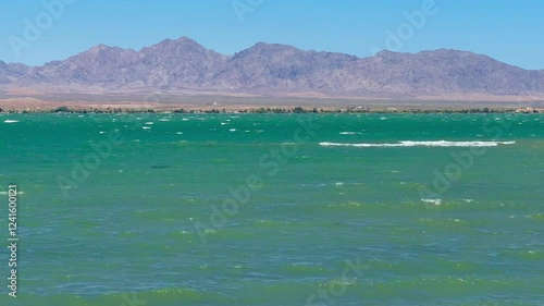 Wallpaper Mural Powerful wind gusts whip Lake Havasu's surface, generating choppy waves and foamy white caps, showcasing nature's raw energy in this popular Arizona waterway. Torontodigital.ca