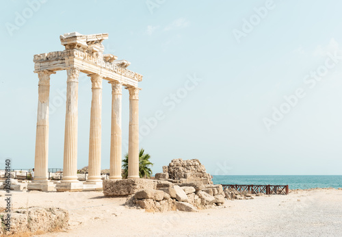 Beautiful Greek ruins on the background of the sea. Temple of Apollo in Side.  Stone columns.