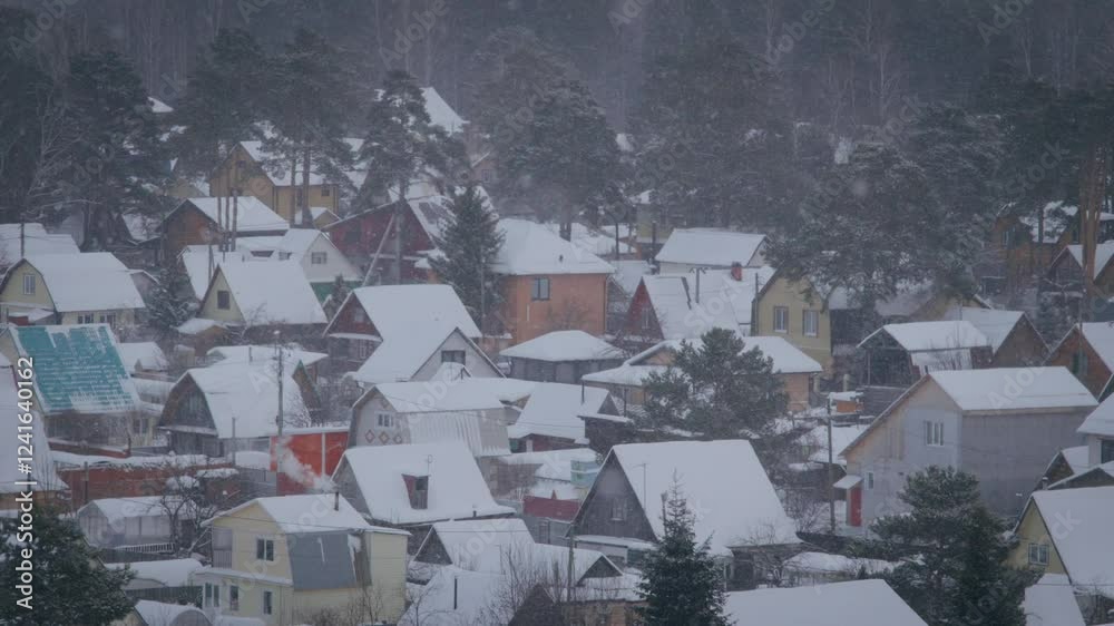 A serene village is enveloped in a soft layer of snow, with charming homes peeking through the white landscape A serene village is enveloped in a soft layer of snow, with charming homes peeking through the white landscape