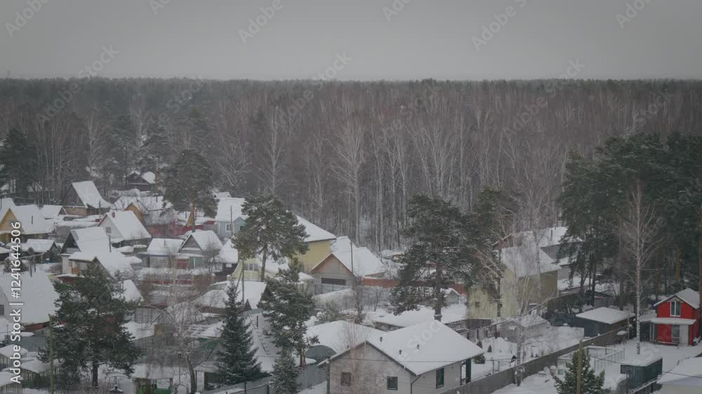 Nestled in the heart of winter, a charming village is blanketed in snow. Colorful rooftops peek through the white Nestled in the heart of winter, a charming village is blanketed in snow. Colorful rooftops peek through the white